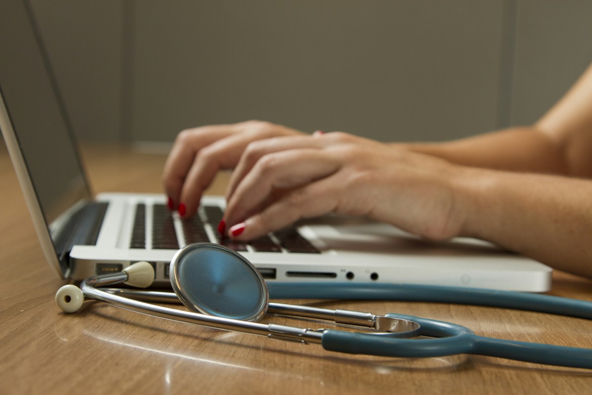 Healthcare workstation with a laptop and stethoscope